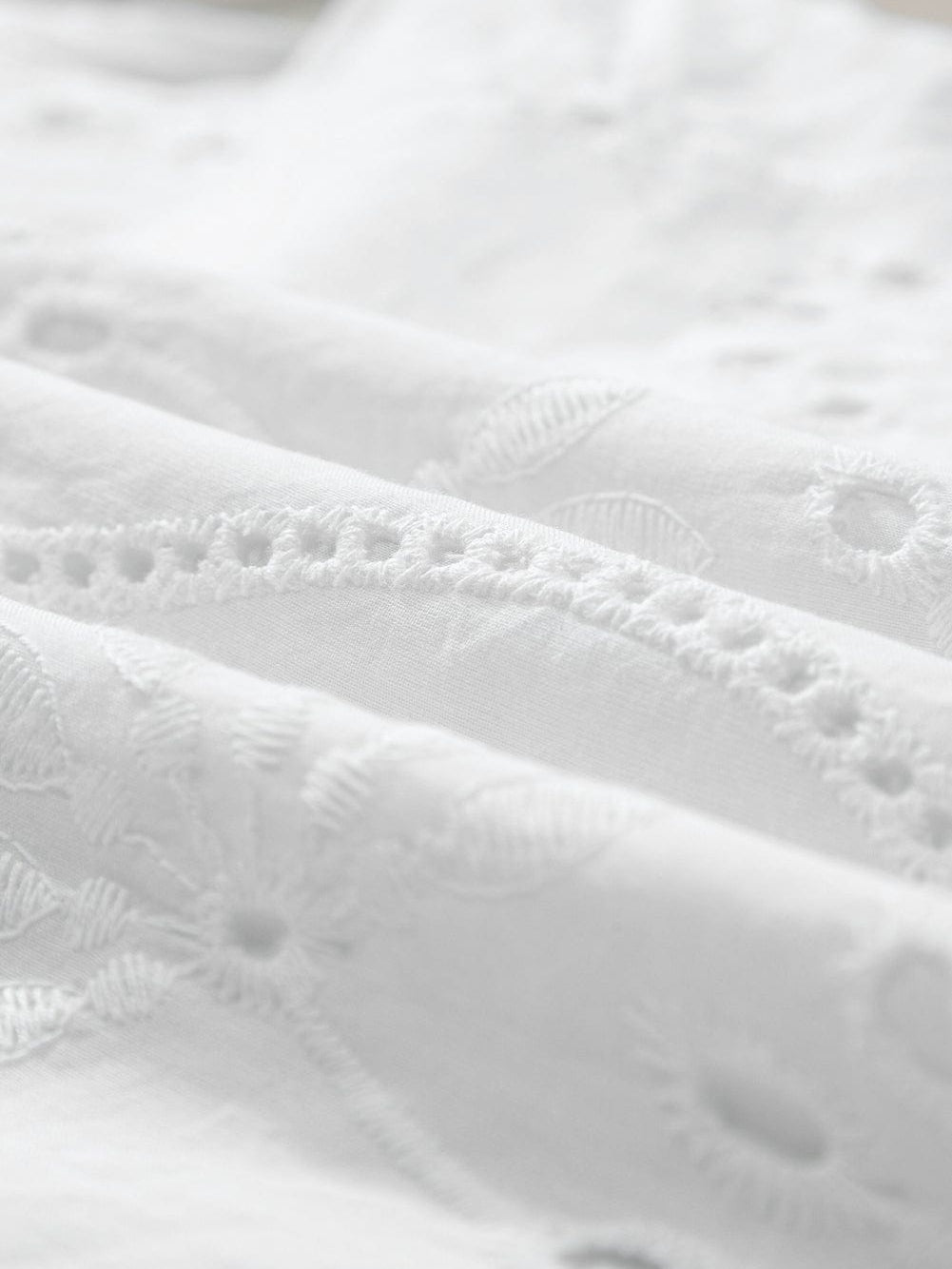 Elegant White Embroidered V-Neck Tank Top with Knotted Straps