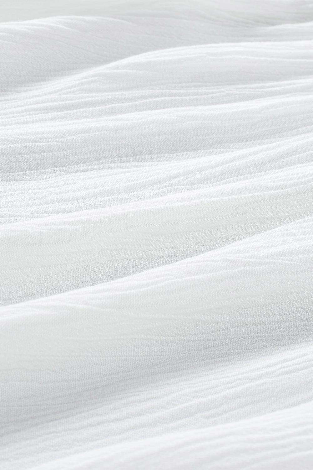 Elegant White Floral Embroidered V-Neck Babydoll Top