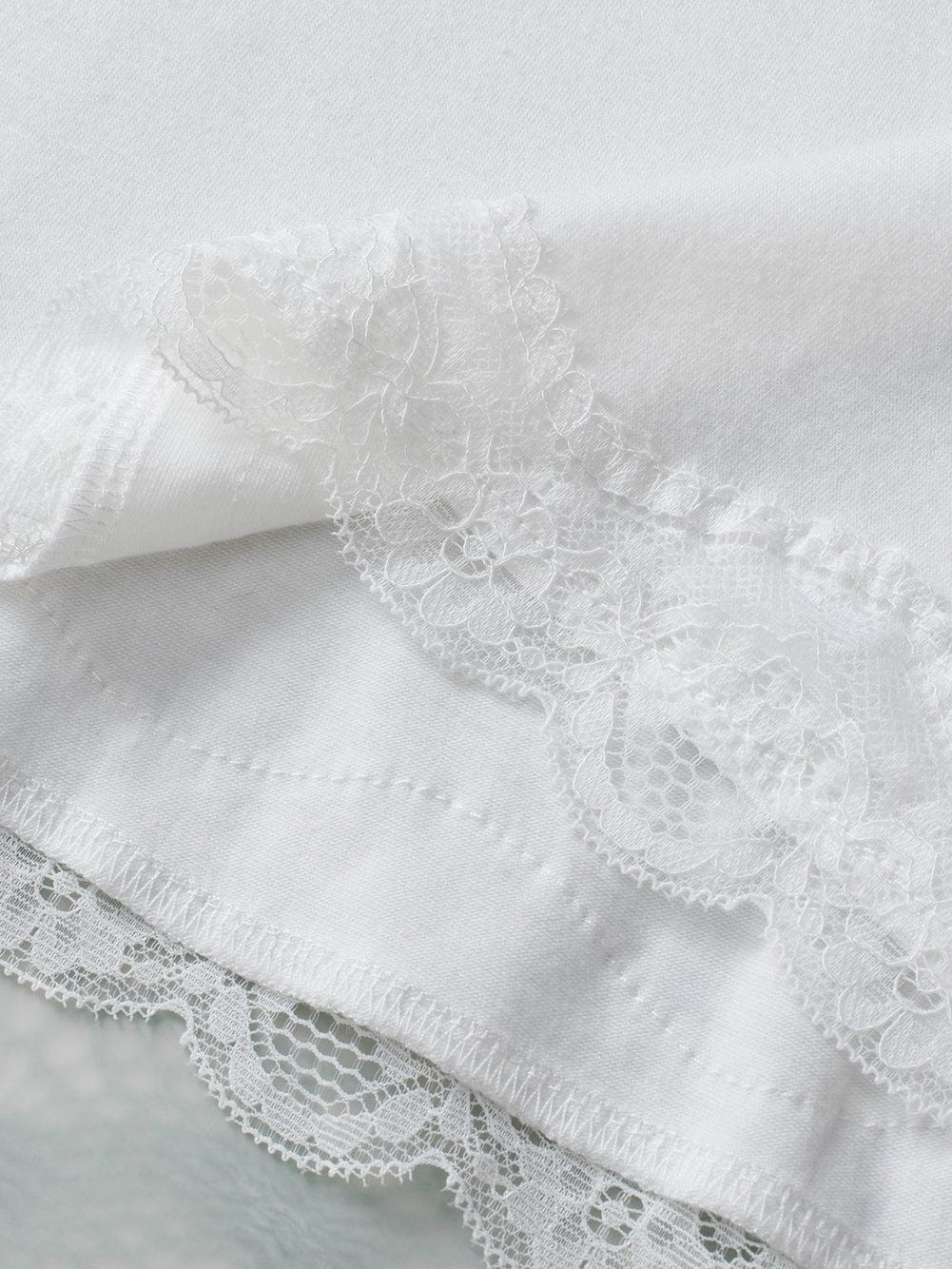 Elegant White Lace-Trimmed Flare Sleeveless Top