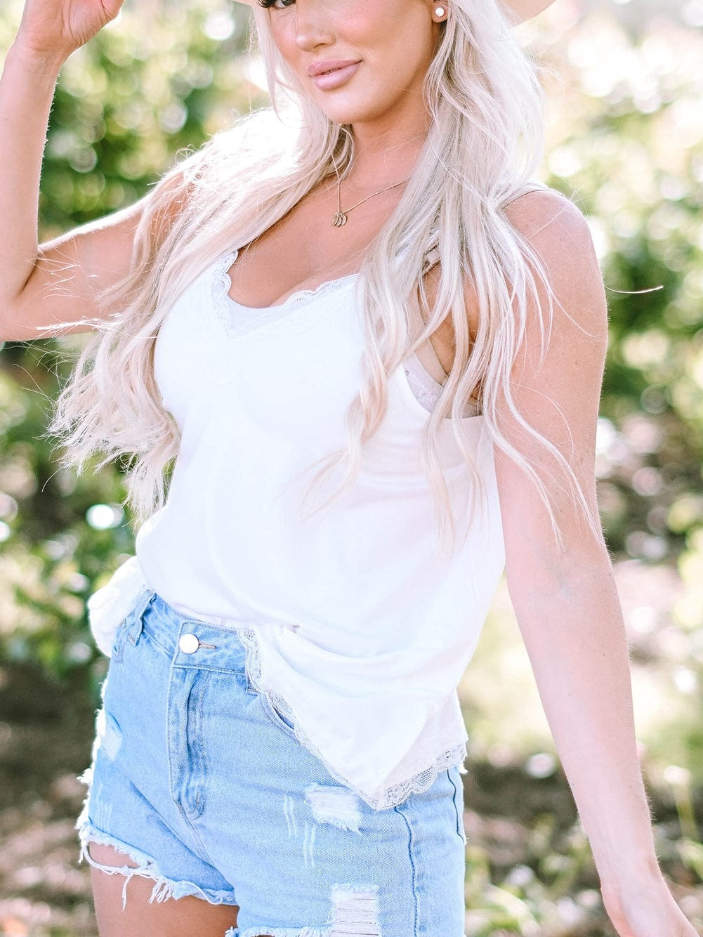 Elegant White Lace-Trimmed Flare Sleeveless Top