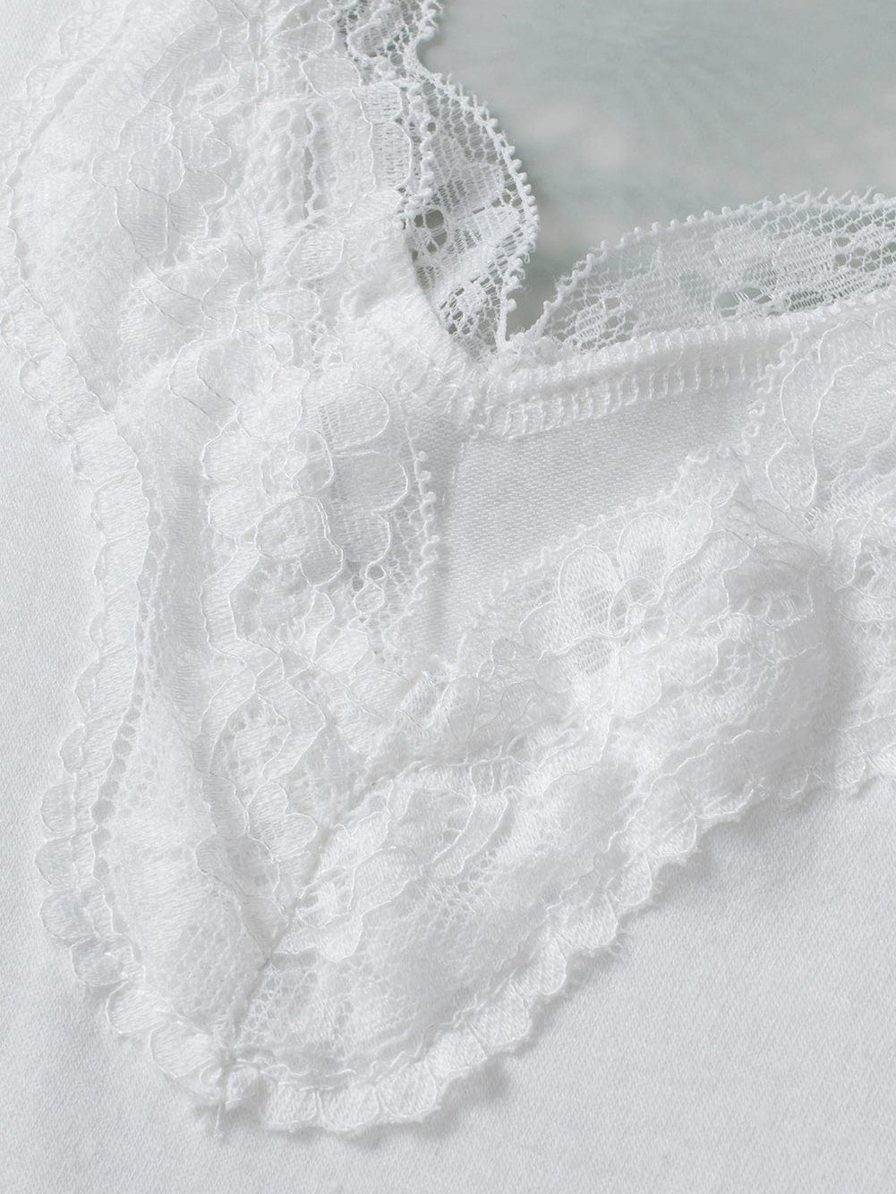 Elegant White Lace-Trimmed Flare Sleeveless Top