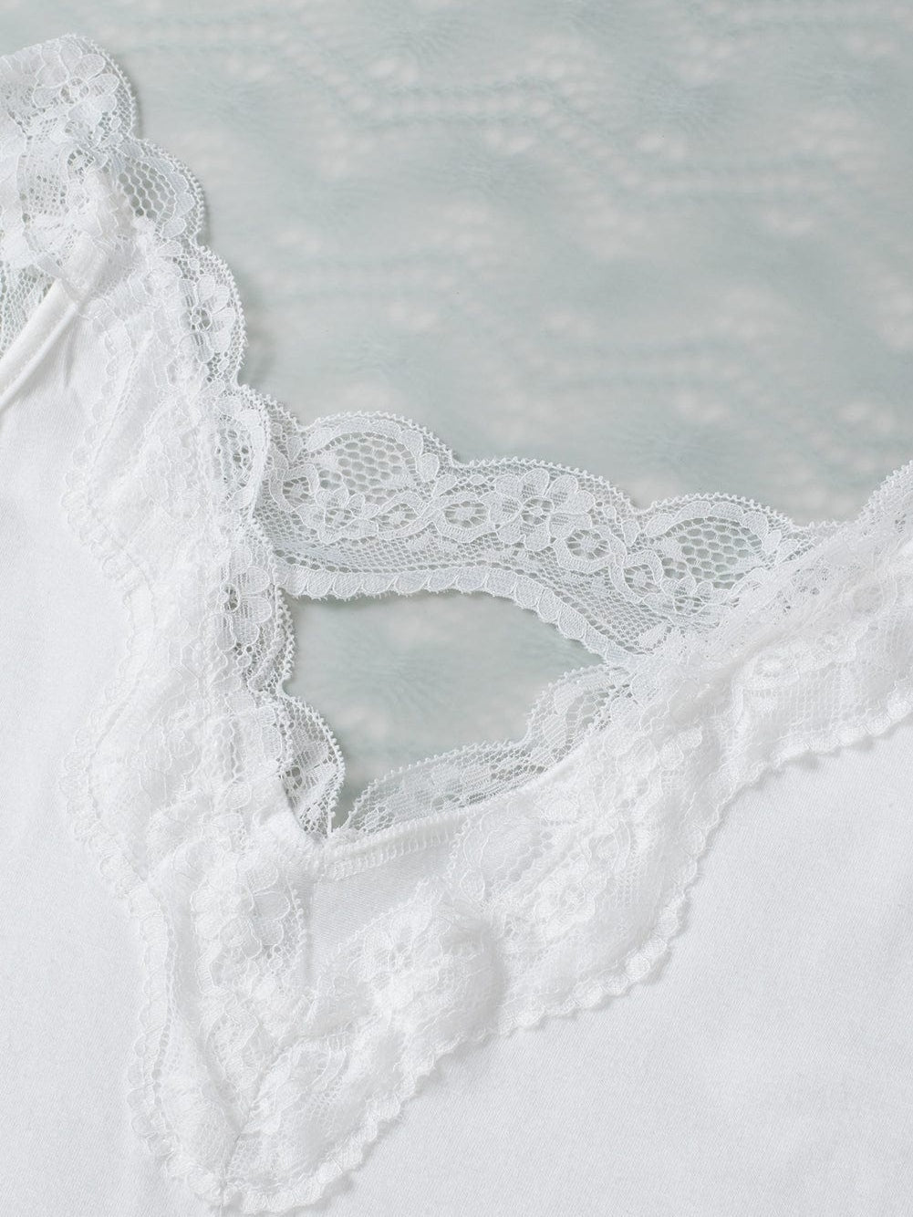 Elegant White Lace-Trimmed Flare Sleeveless Top