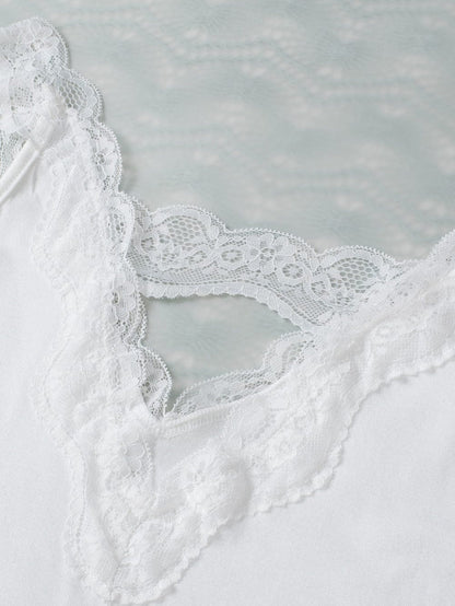 Elegant White Lace-Trimmed Flare Sleeveless Top