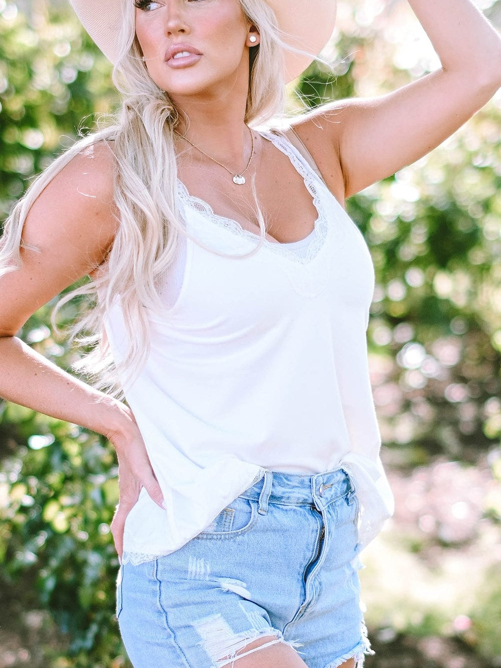 Elegant White Lace-Trimmed Flare Sleeveless Top