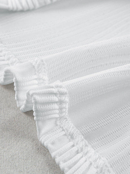 Elegant White Textured Cap Sleeve Blouse