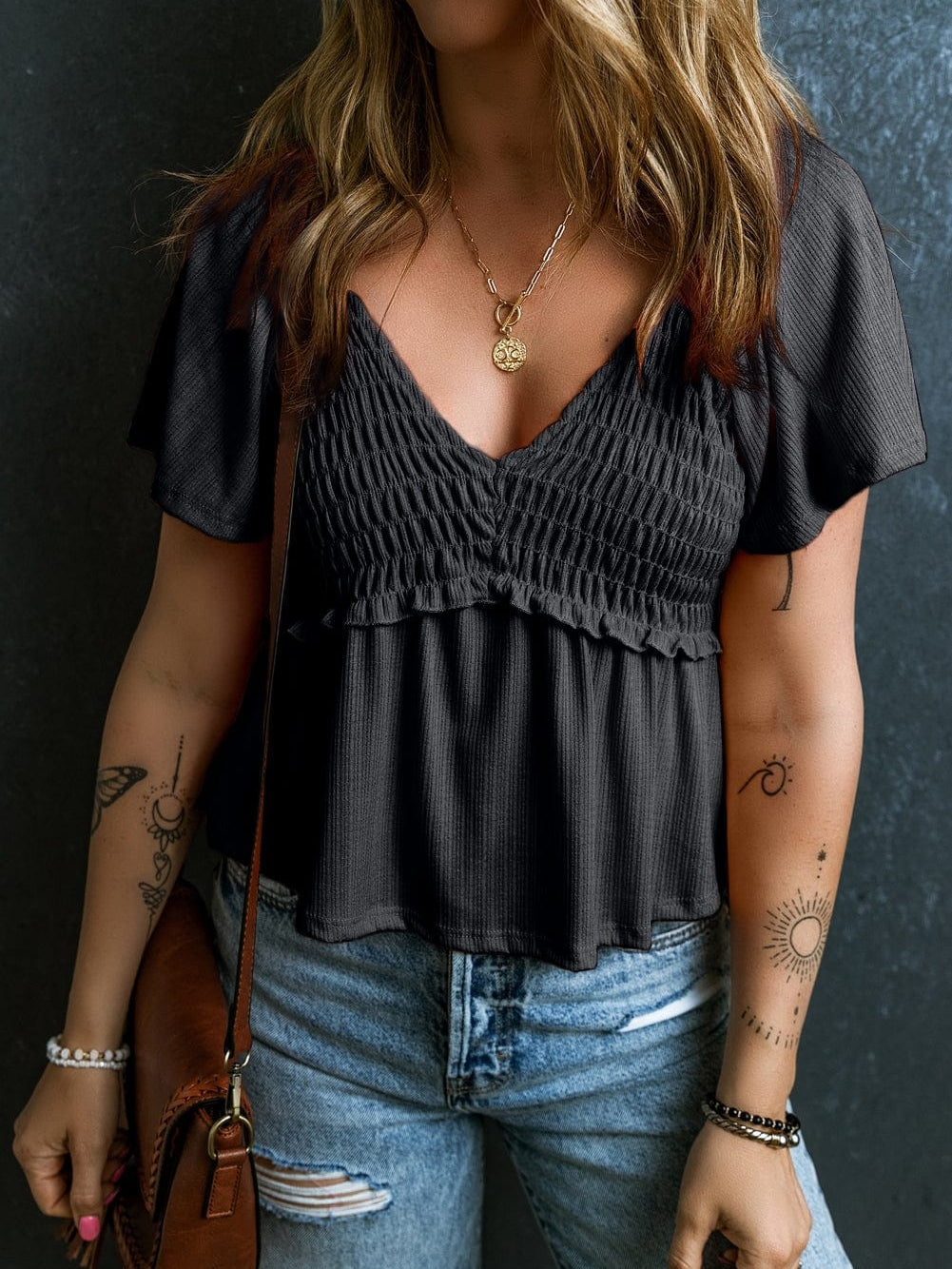 Flirty Black Textured Peplum Blouse with V Neck and Flutter Sleeves