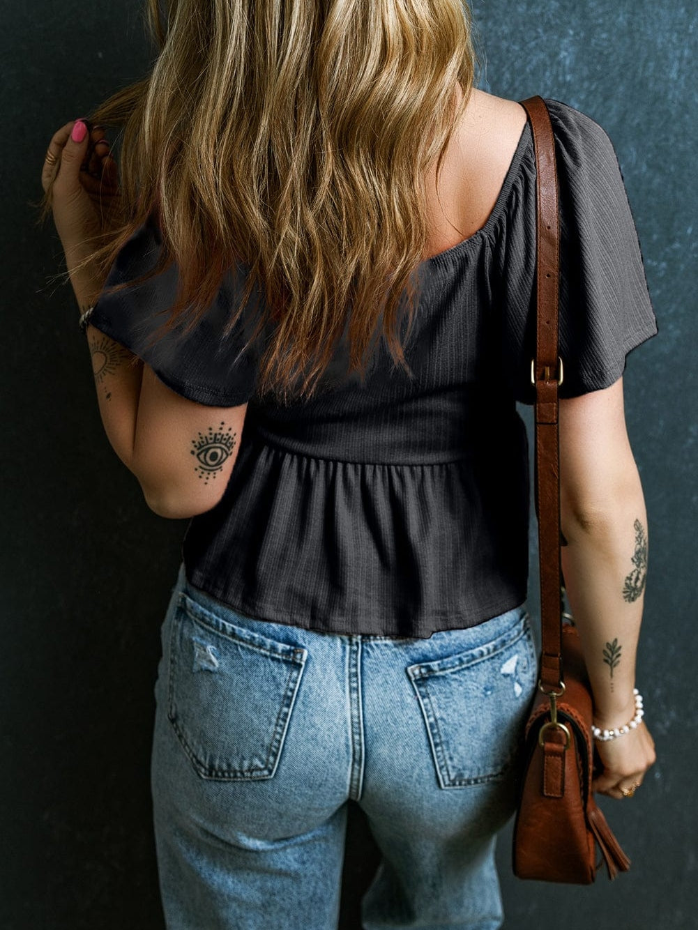 Flirty Black Textured Peplum Blouse with V Neck and Flutter Sleeves