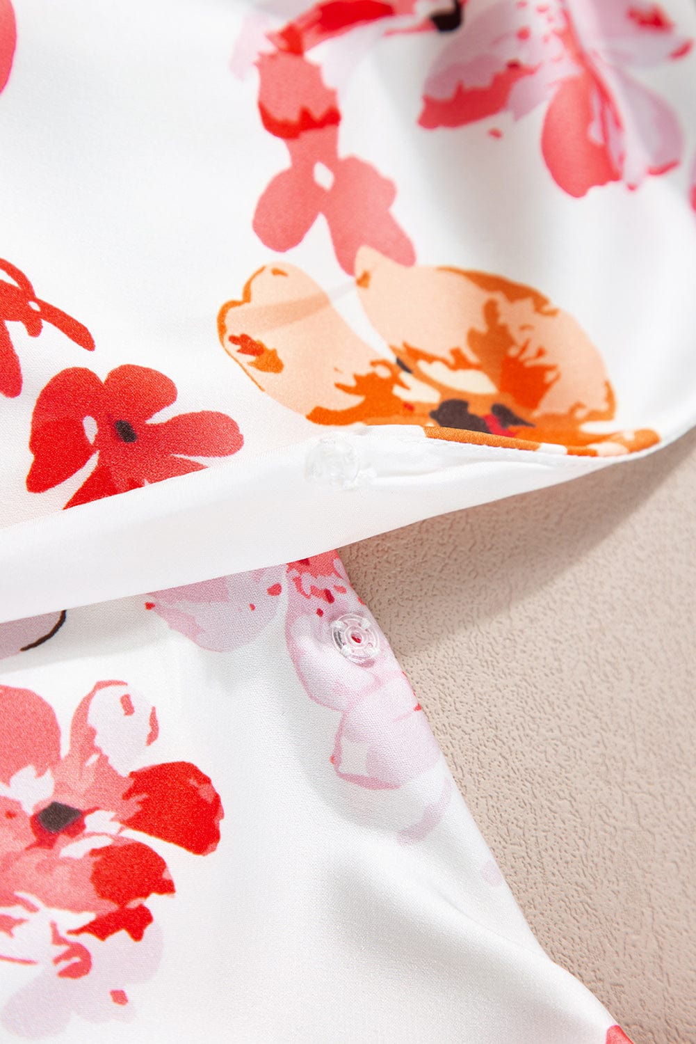 Floral Wrap Sleeveless Bodysuit with White Button Accent