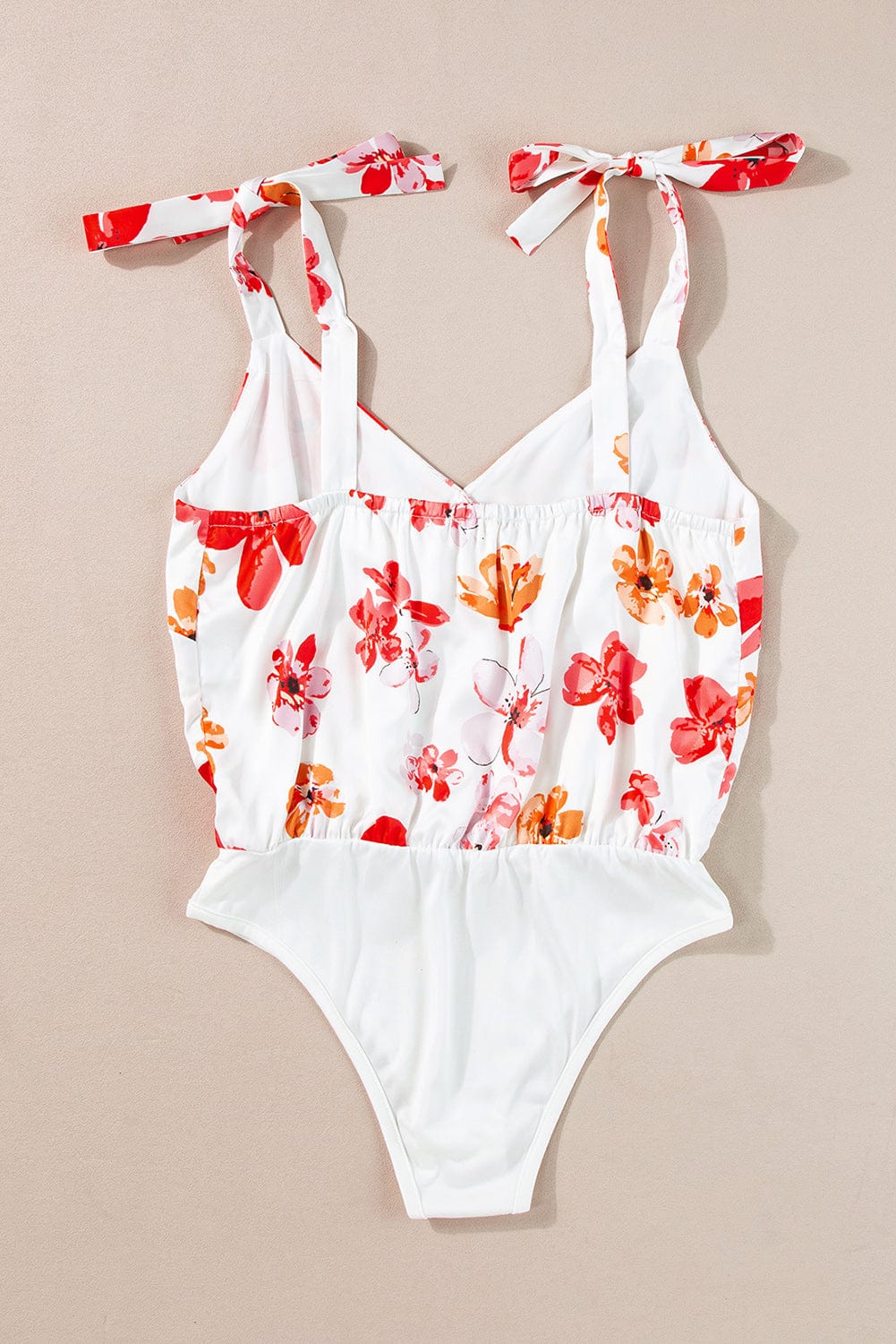 Floral Wrap Sleeveless Bodysuit with White Button Accent