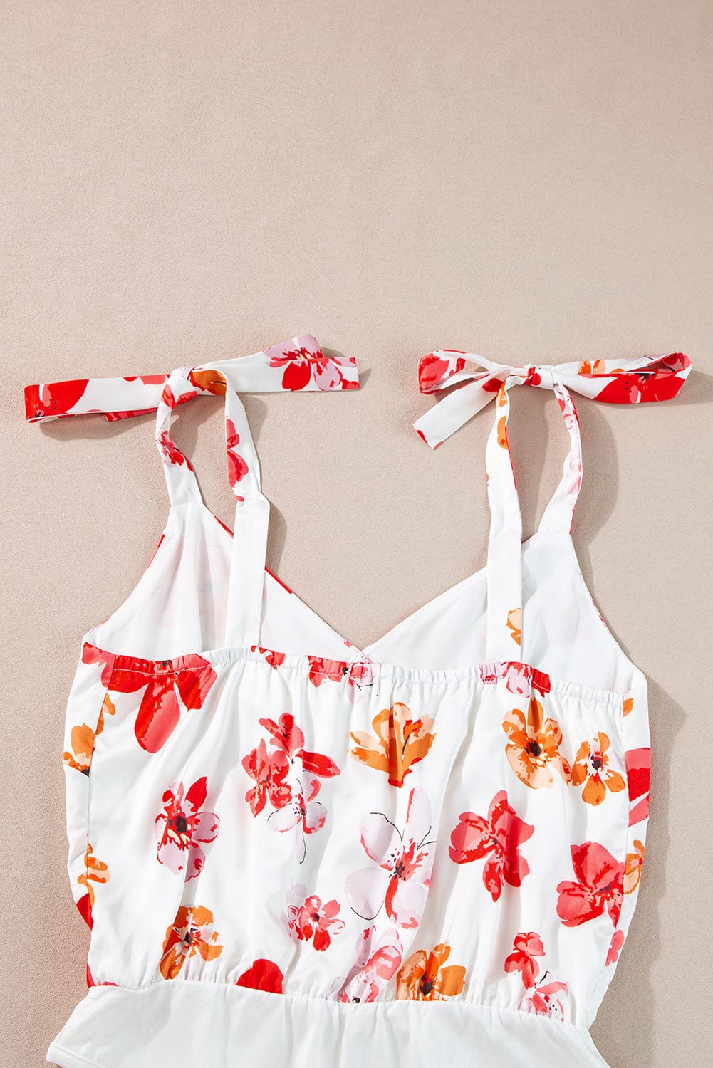 Floral Wrap Sleeveless Bodysuit with White Button Accent