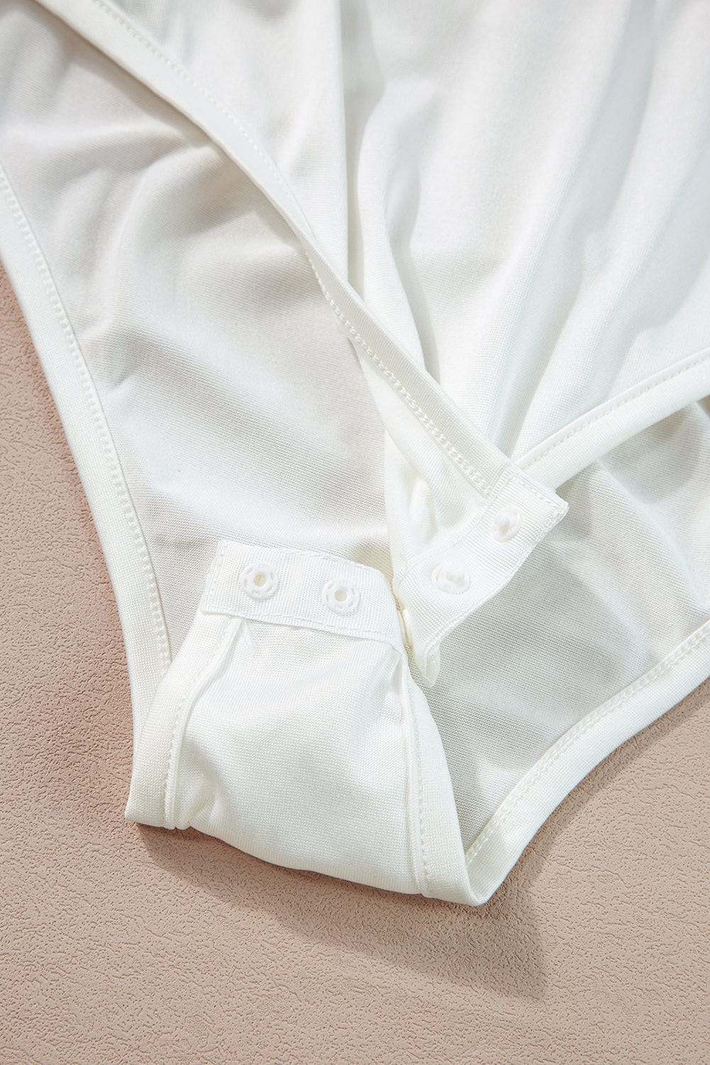 Floral Wrap Sleeveless Bodysuit with White Button Accent