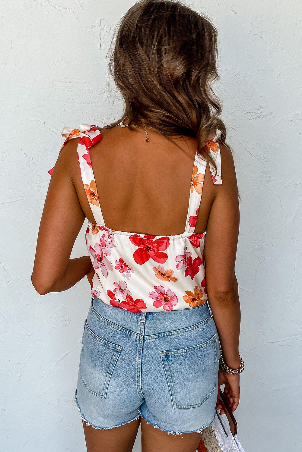 Floral Wrap Sleeveless Bodysuit with White Button Accent