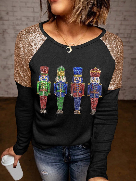 Glittery Black Nutcracker Graphic Top with Sequined Sleeves
