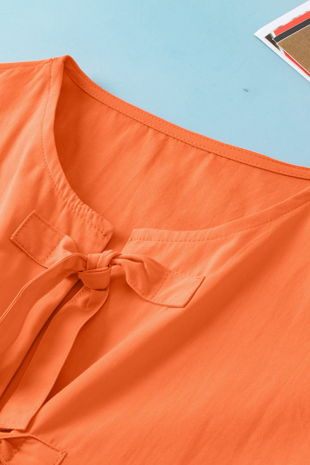 Grapefruit Orange Knotted Puff Peplum Blouse with Short Sleeves