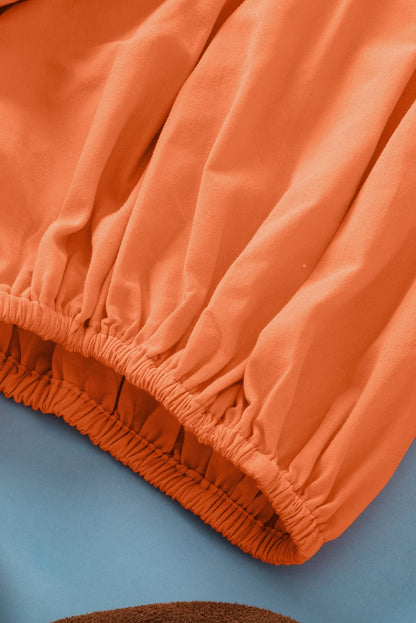 Grapefruit Orange Knotted Puff Peplum Blouse with Short Sleeves