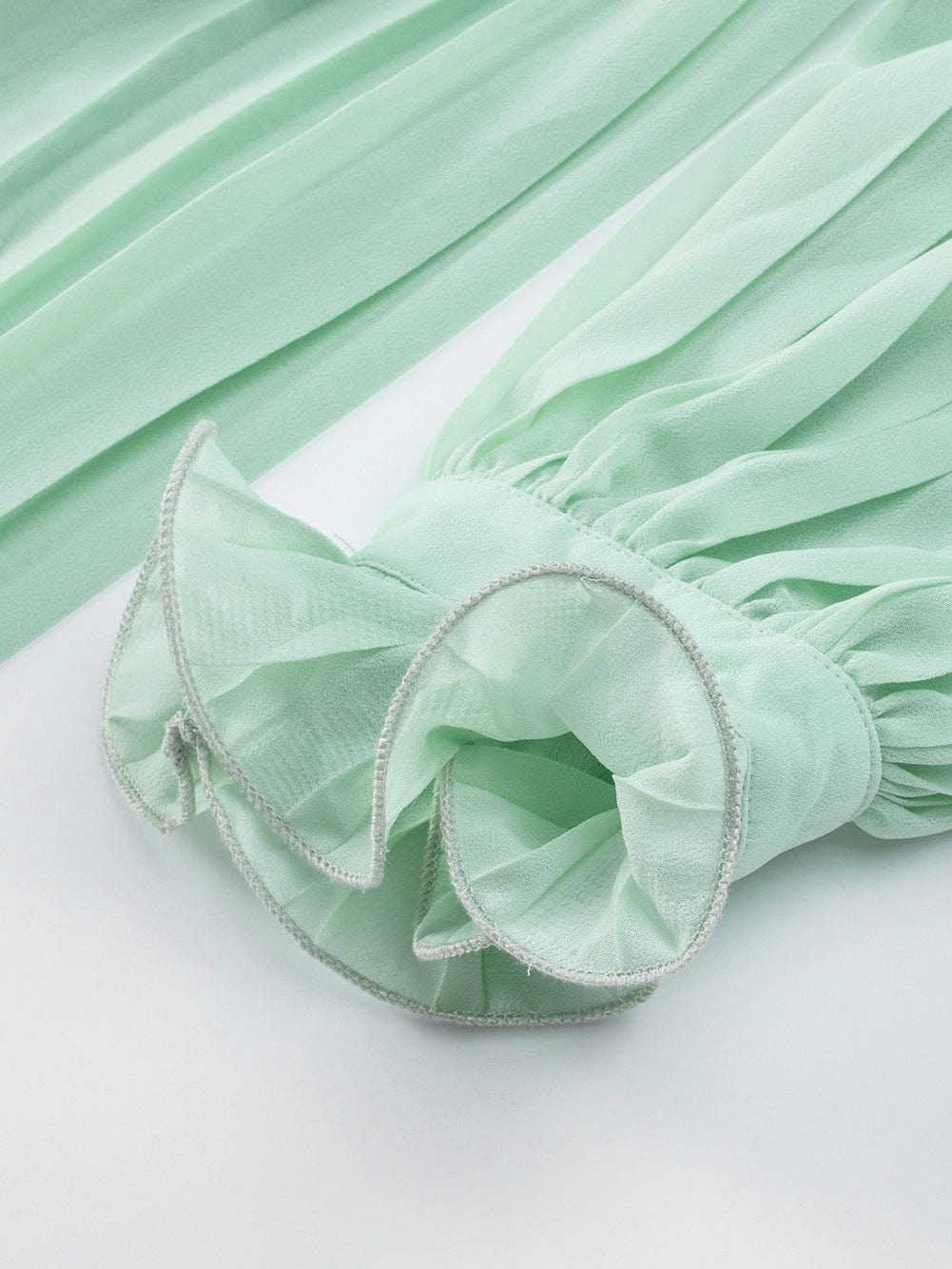 Green Pleated V-Neck Romper with Tie Waist and Ruffled Details