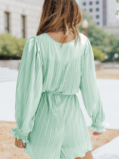 Green Pleated V-Neck Romper with Tie Waist and Ruffled Details