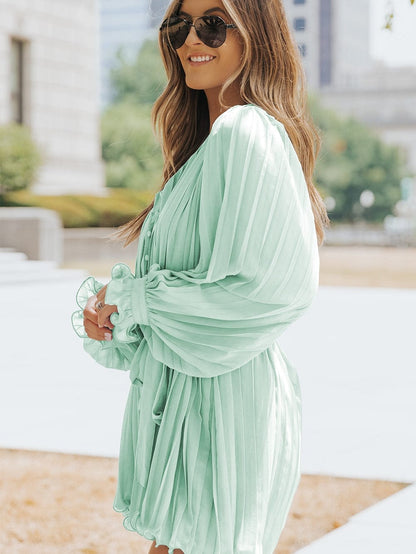 Green Pleated V-Neck Romper with Tie Waist and Ruffled Details