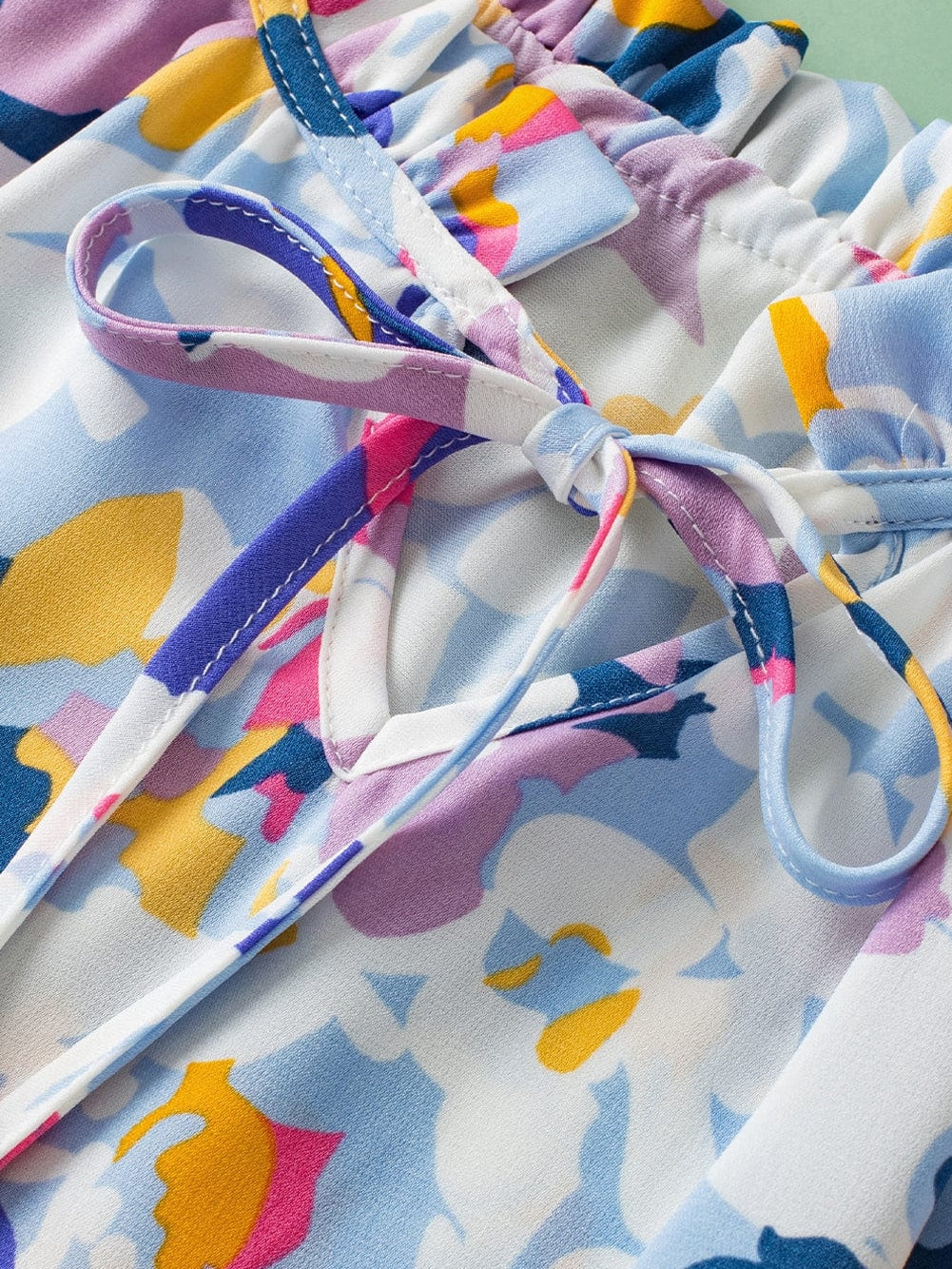 Light Blue Floral Flutter Sleeve V-Neck Blouse with Ruffle Details