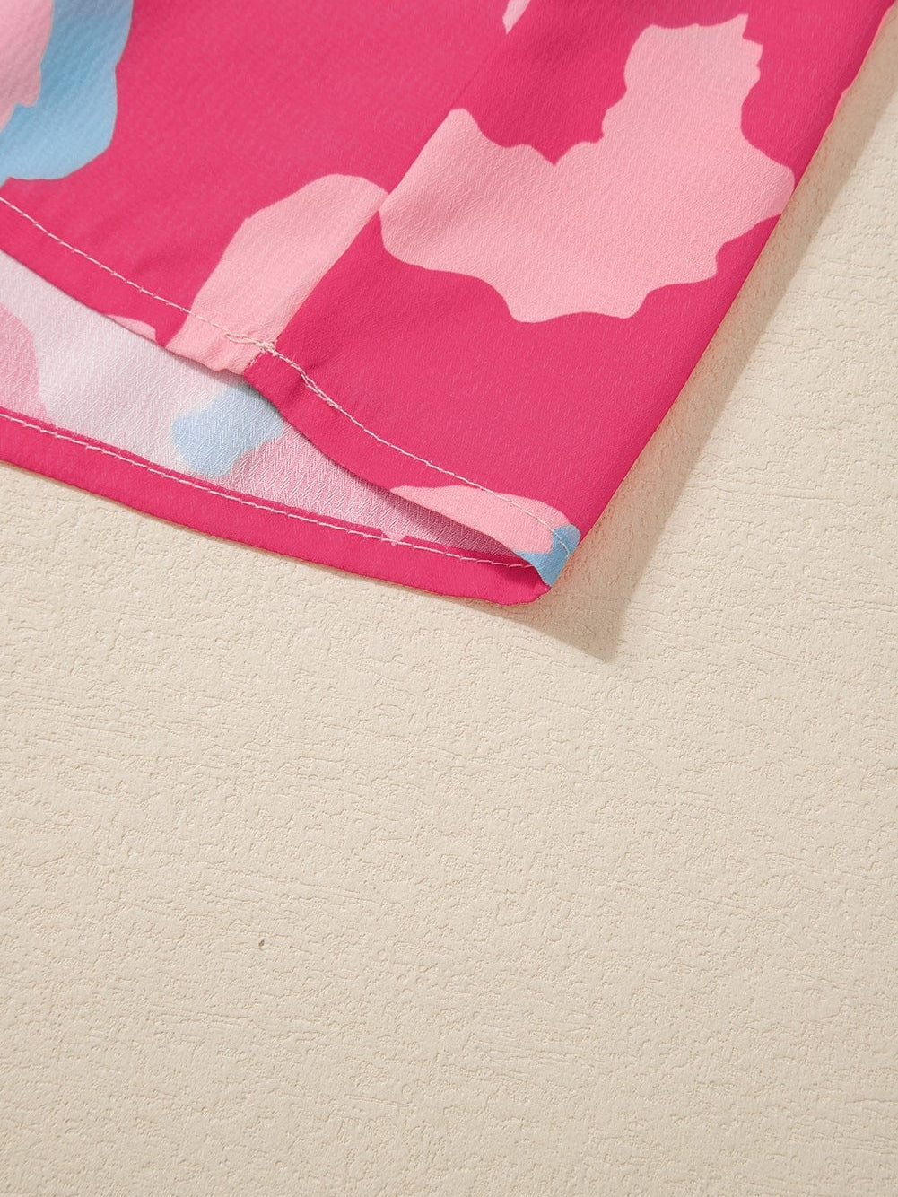 Rose Abstract Print Ruffle Hem V Neck Blouse