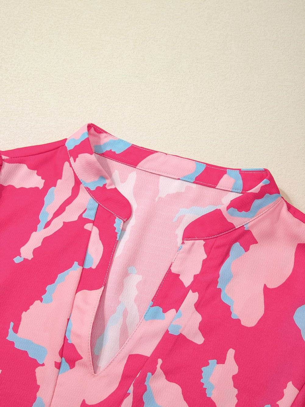 Rose Abstract Print Ruffle Hem V Neck Blouse