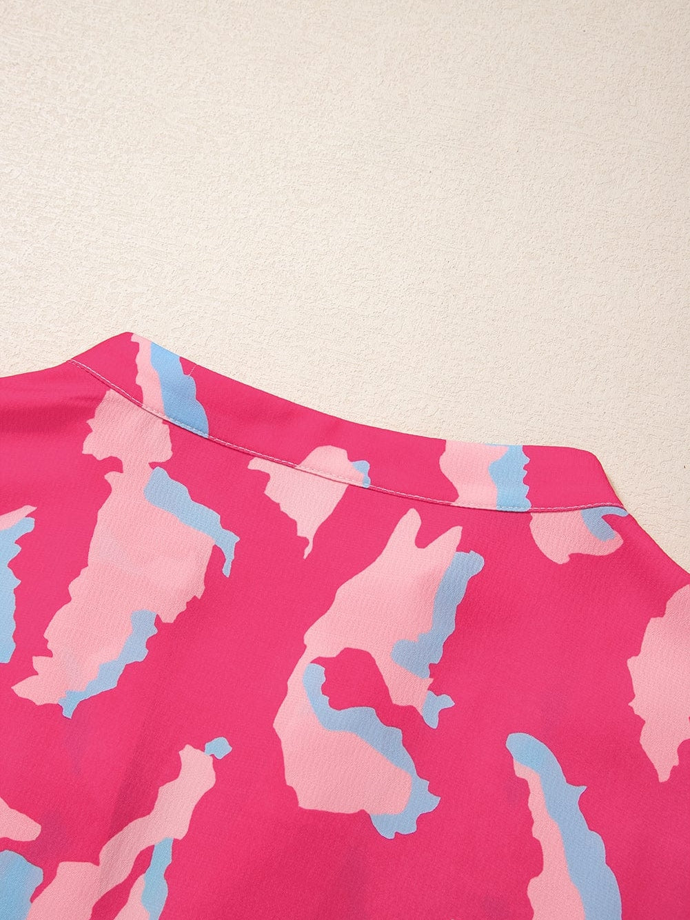 Rose Abstract Print Ruffle Hem V Neck Blouse