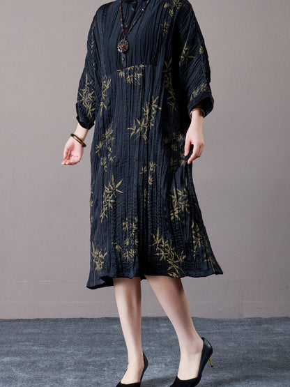 Elegant Black Pleated Maxi Dress with Golden Bamboo Motif