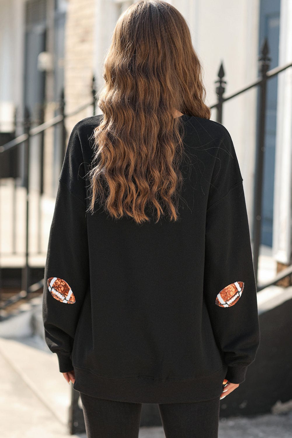 Shimmering Black Sequin Rugby Graphic Sweater