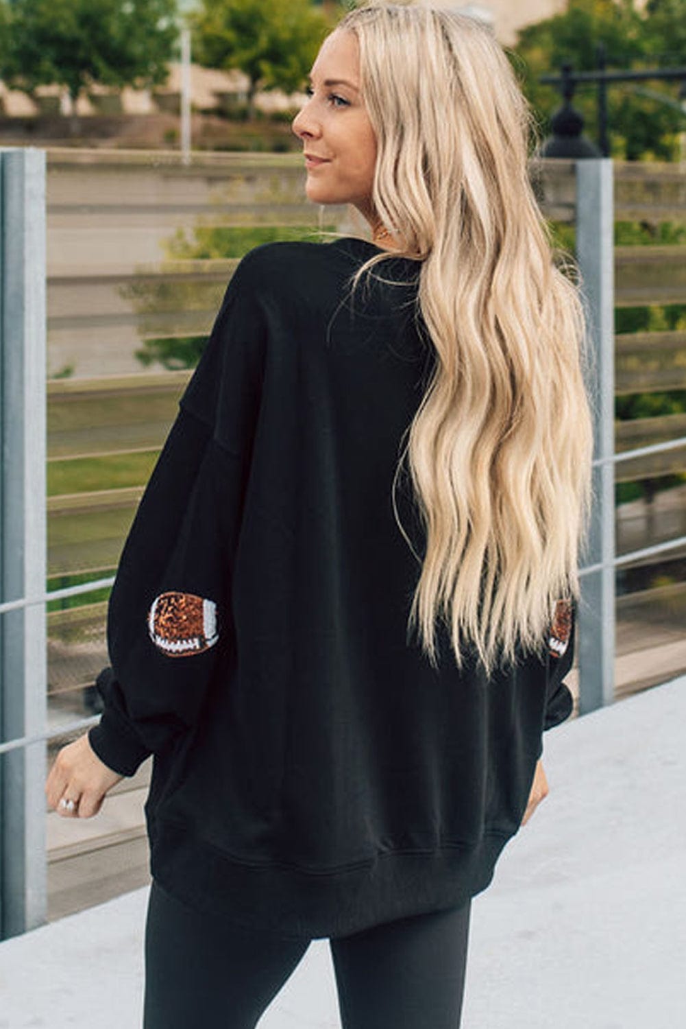Shimmering Black Sequin Rugby Graphic Sweater