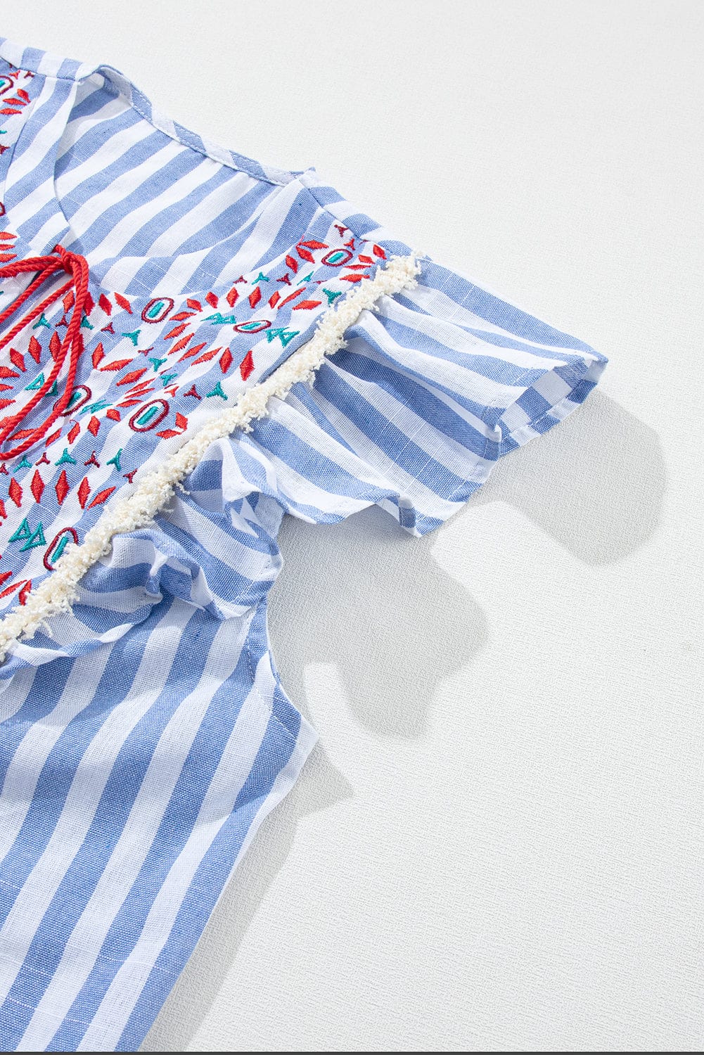 Sky Blue Aztec Embroidered Flutter Blouse with Tassel Accents