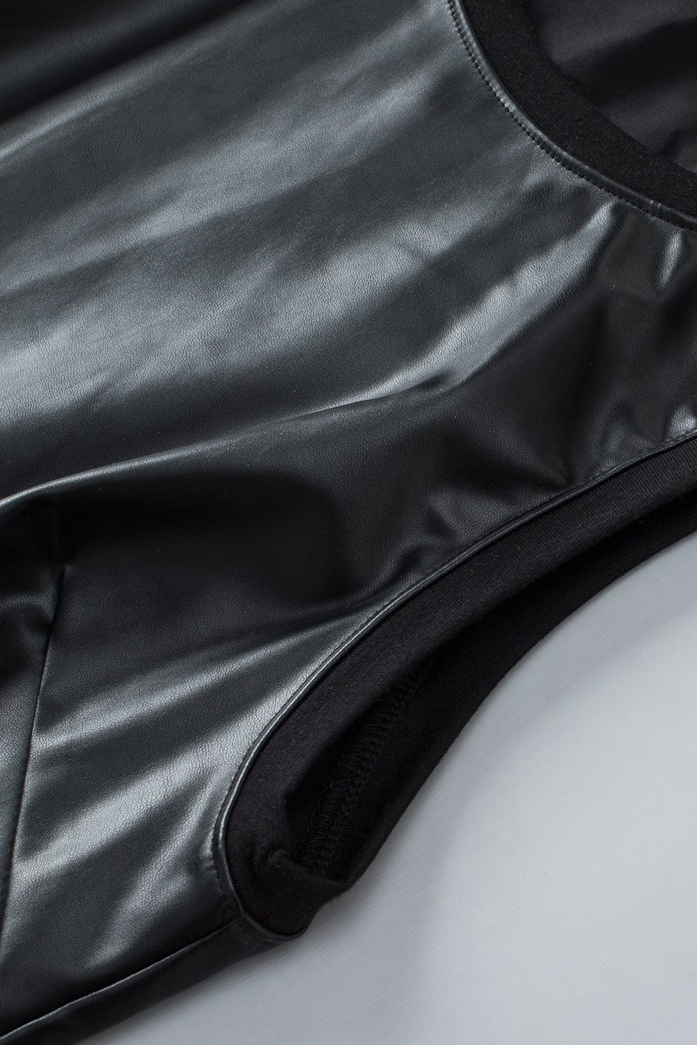 Sleek Black Faux Leather Crew Neck Sleeveless Top
