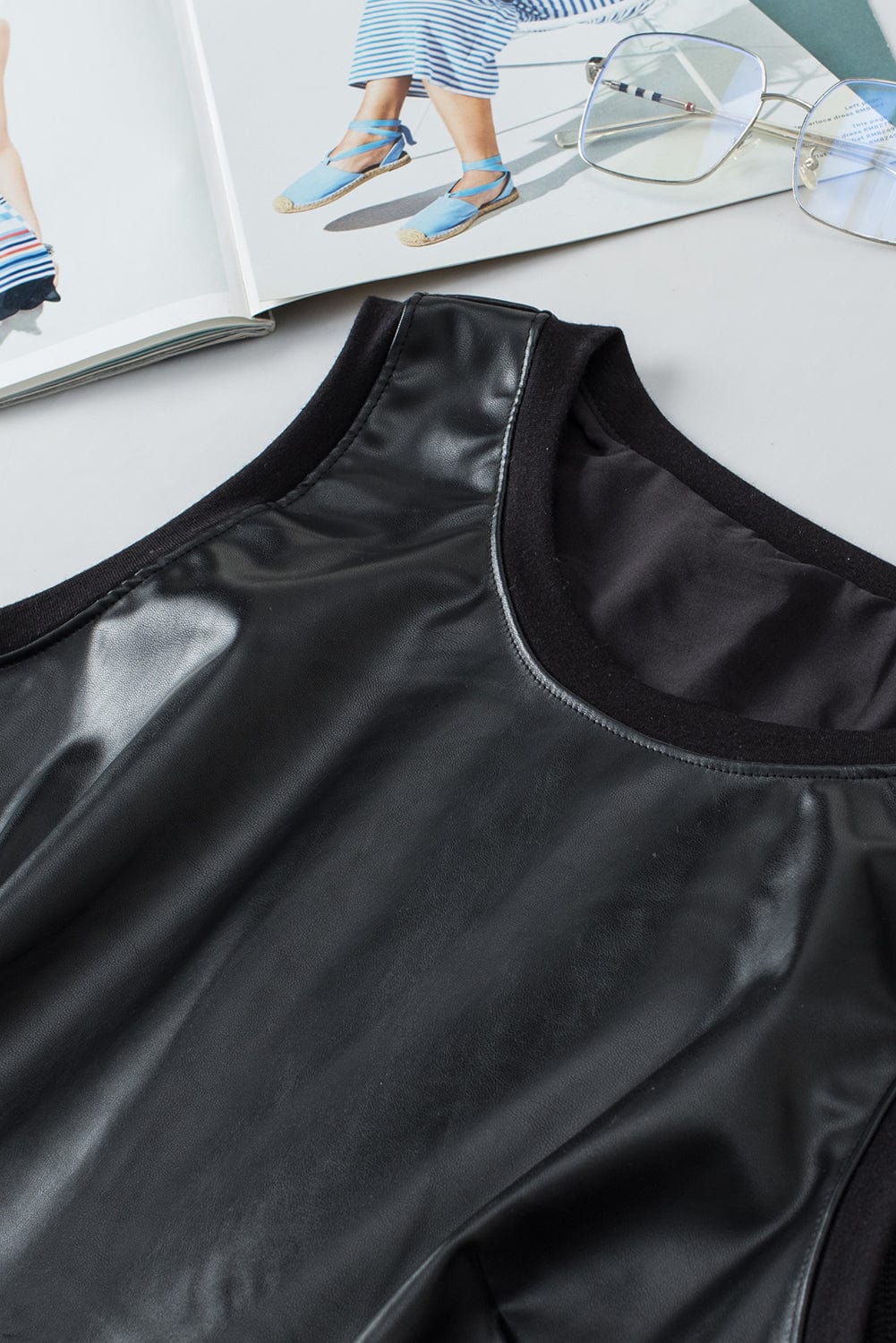 Sleek Black Faux Leather Crew Neck Sleeveless Top