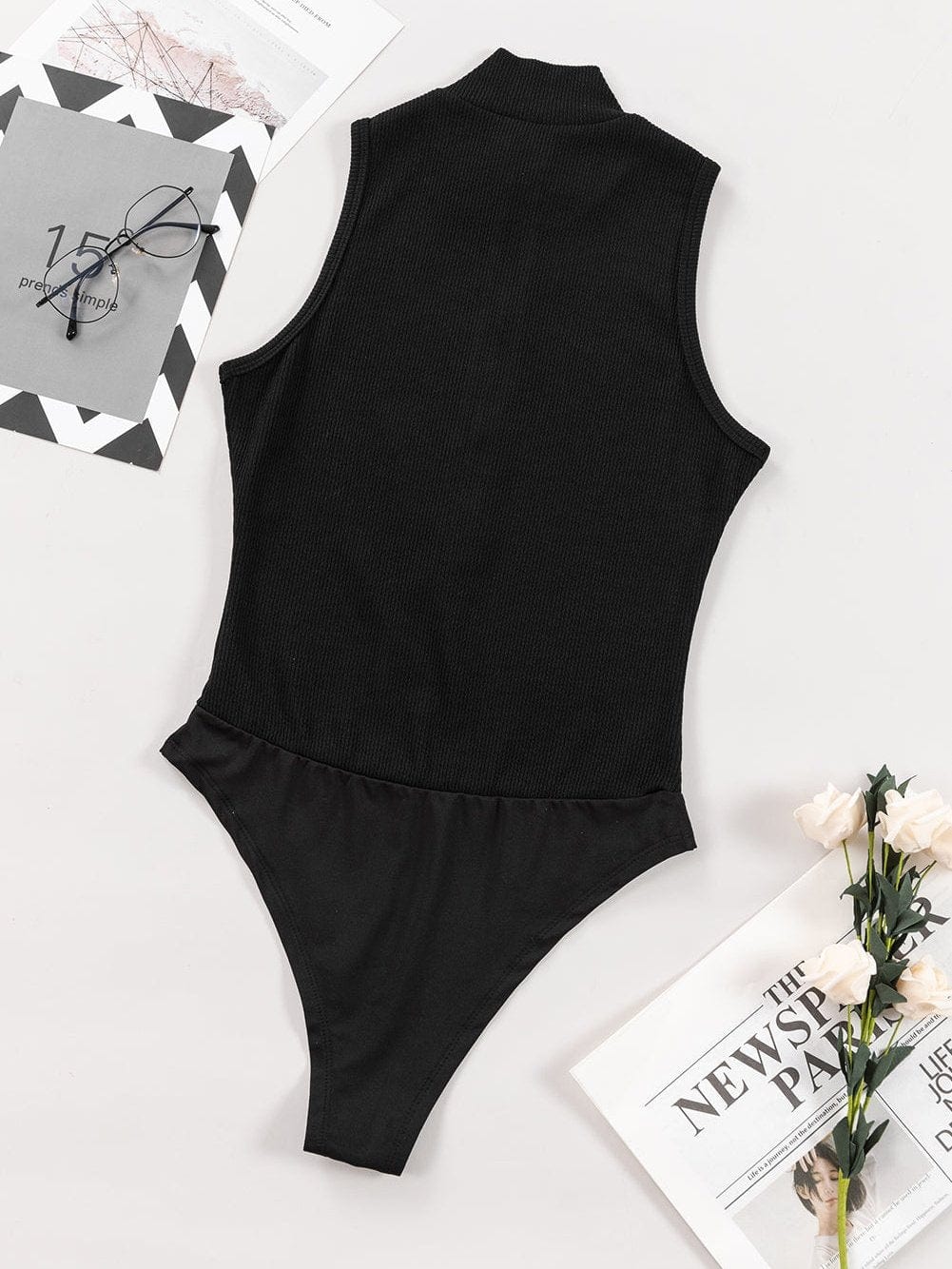 Sleek Black Ribbed Sleeveless Bodysuit with Mock Neck Zip-Up Style