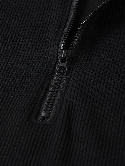 Sleek Black Ribbed Sleeveless Bodysuit with Mock Neck Zip-Up Style