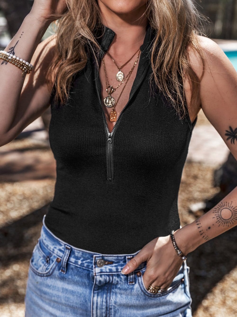 Sleek Black Ribbed Sleeveless Bodysuit with Mock Neck Zip-Up Style