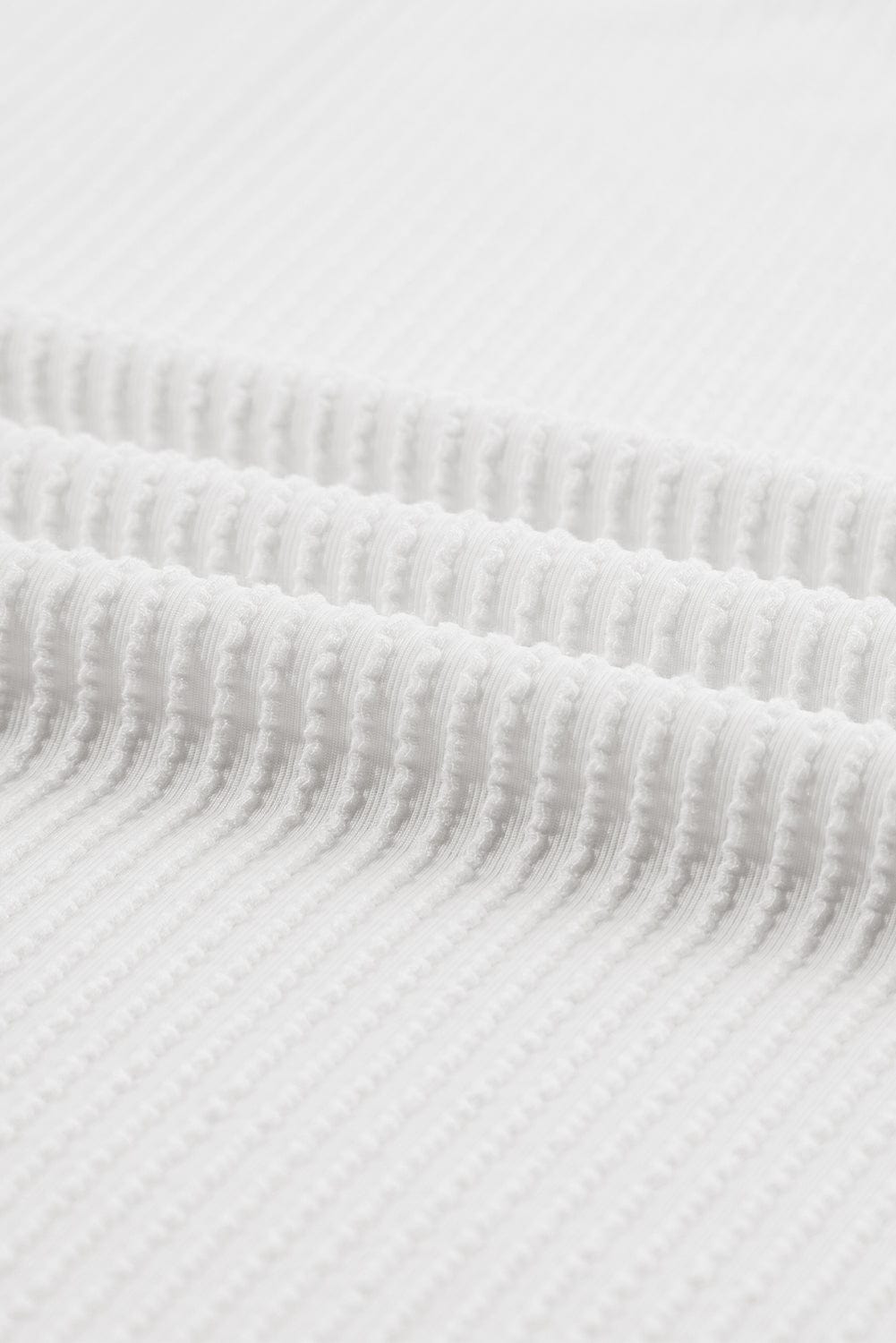 Stylish White Ribbed Knit Top with Quarter Sleeves