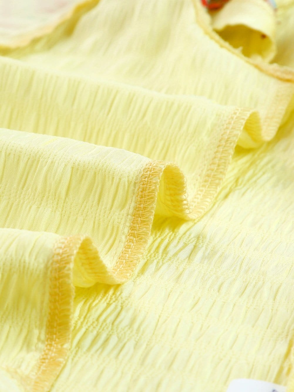 Sunny Yellow Embroidered Ruffle Top with Geometric Details