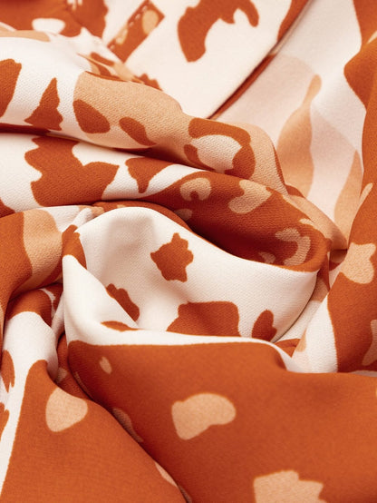 Swing into Style with the Brown Multi Print Dress