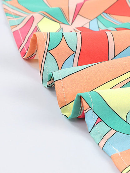 Vibrant Geometric Pattern Flared Dress with Tassel Detail