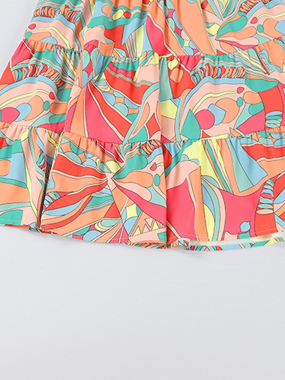 Vibrant Geometric Pattern Flared Dress with Tassel Detail