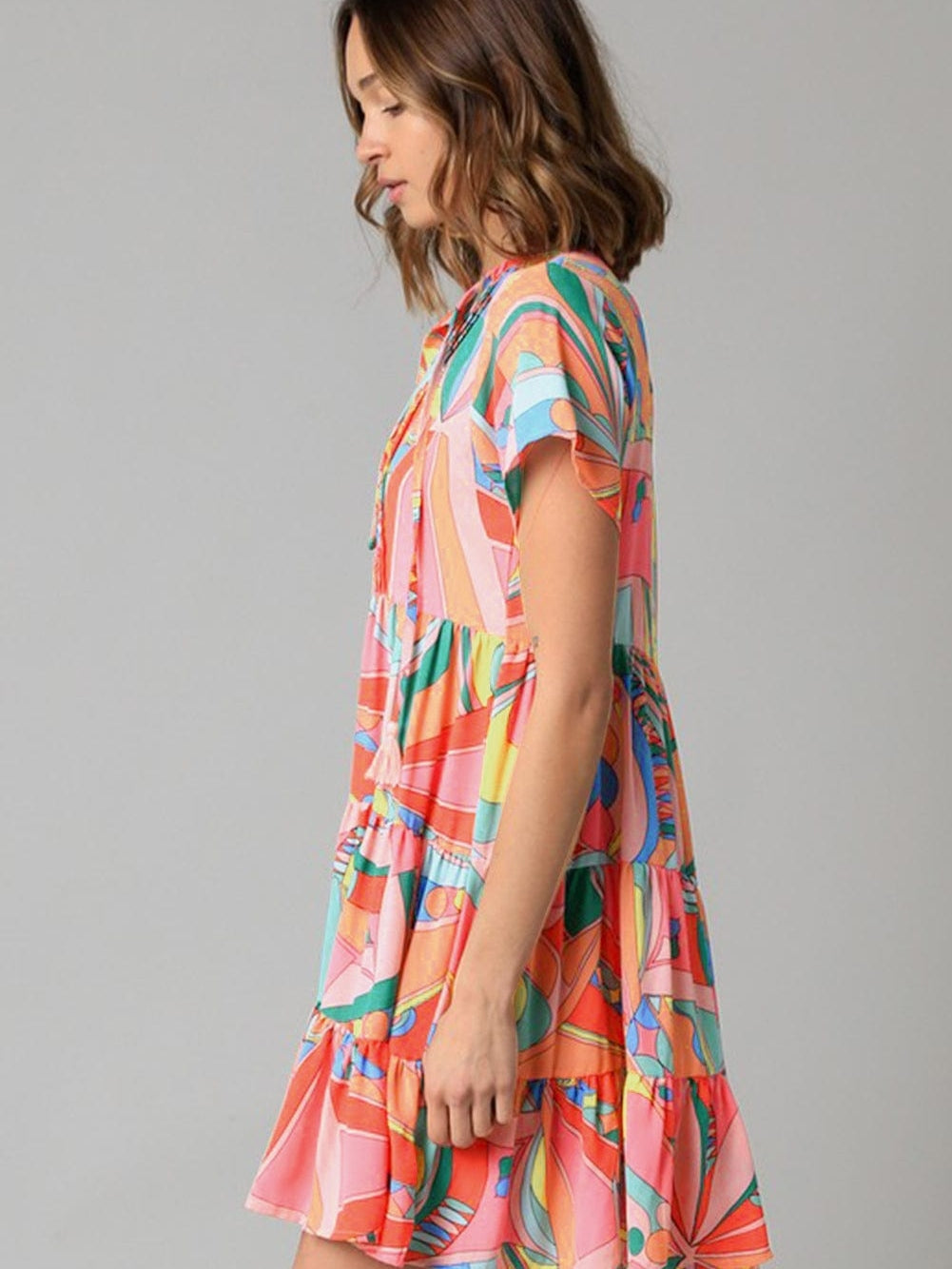Vibrant Geometric Pattern Flared Dress with Tassel Detail
