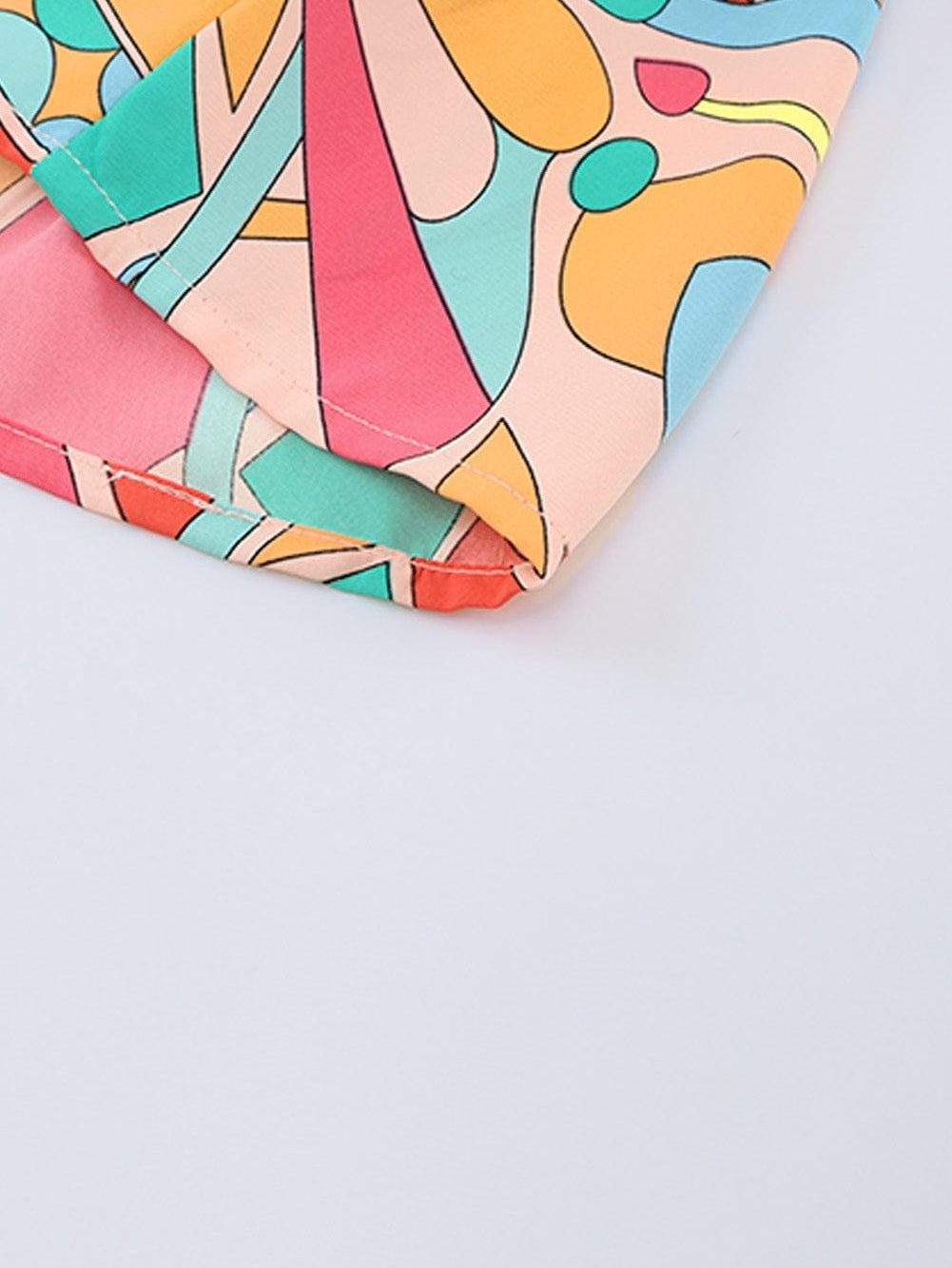 Vibrant Geometric Pattern Flared Dress with Tassel Detail