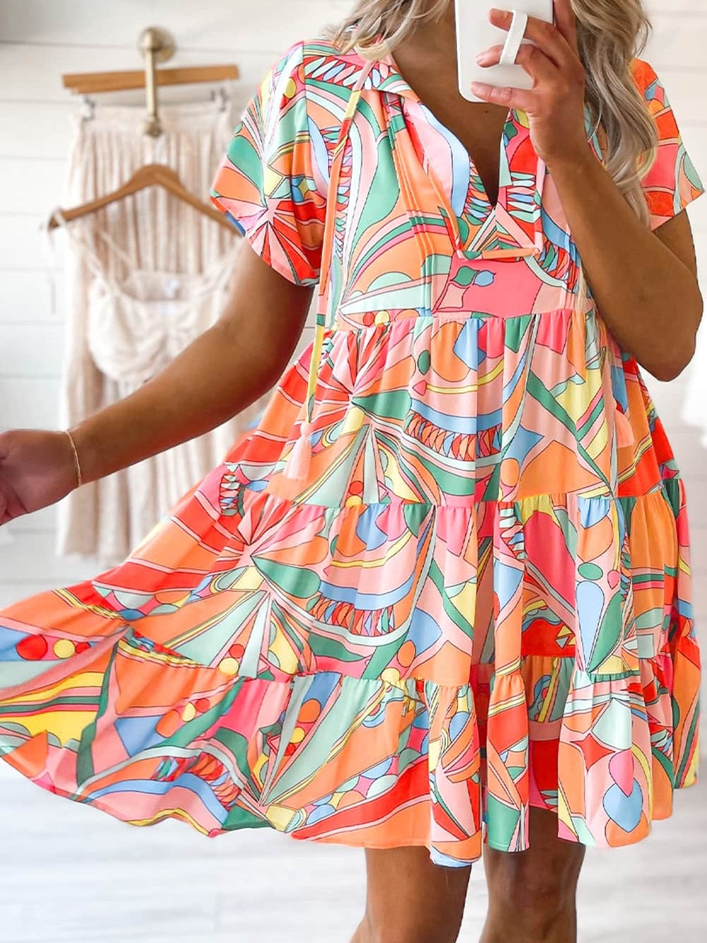 Vibrant Geometric Pattern Flared Dress with Tassel Detail