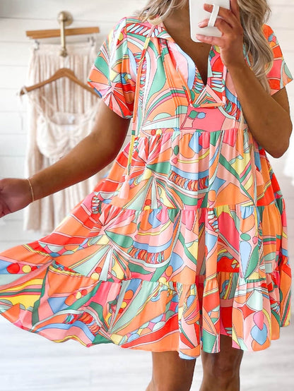 Vibrant Geometric Pattern Flared Dress with Tassel Detail