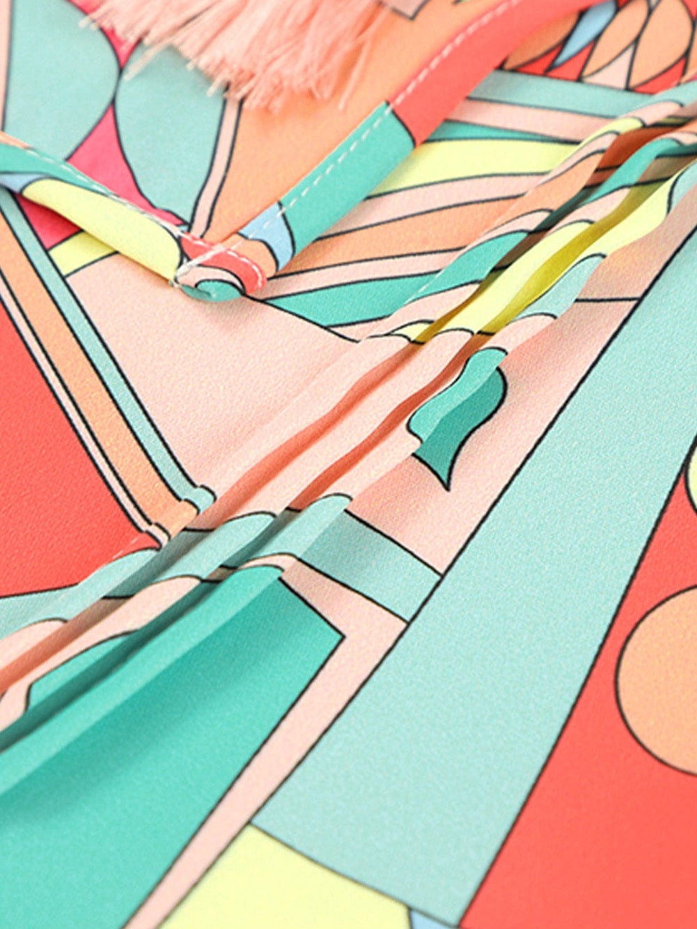 Vibrant Geometric Pattern Flared Dress with Tassel Detail