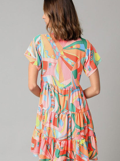 Vibrant Geometric Pattern Flared Dress with Tassel Detail