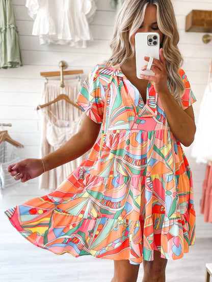 Vibrant Geometric Pattern Flared Dress with Tassel Detail