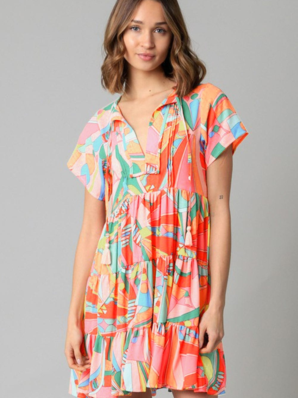 Vibrant Geometric Pattern Flared Dress with Tassel Detail