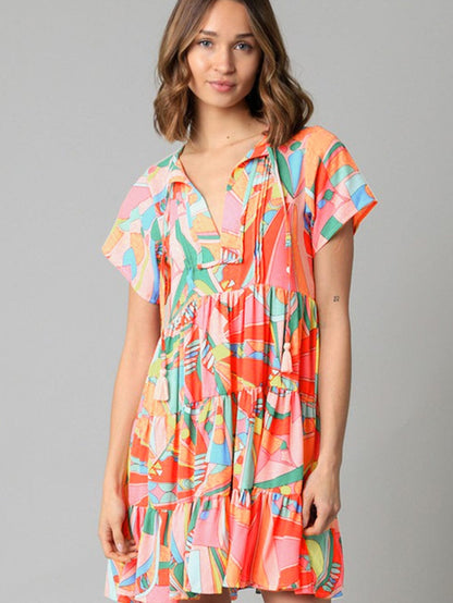 Vibrant Geometric Pattern Flared Dress with Tassel Detail