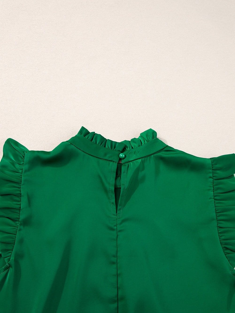 Vibrant Green Pleated Sleeveless Blouse with Frilled Mock Neck